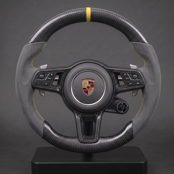 Custom Porsche carbon steering wheel in gray Alcantara with a yellow 12 o'clock stripe, twill carbon and paddles, original OEM base