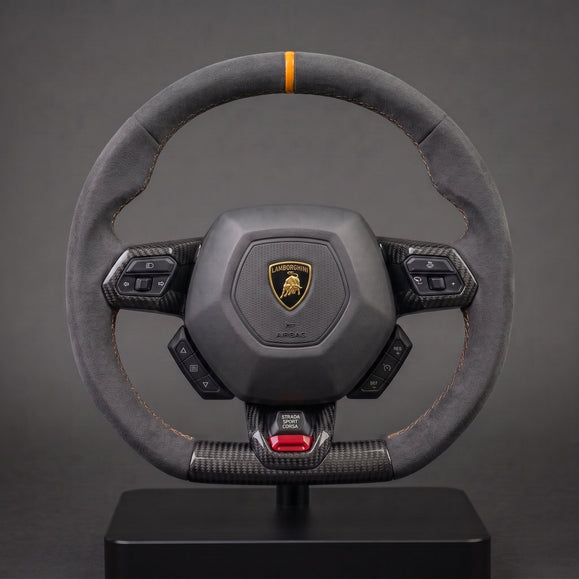 Custom carbon steering wheel for Lamborghini Huracán in grey Alcantara with orange centering stripe, full view on a stand