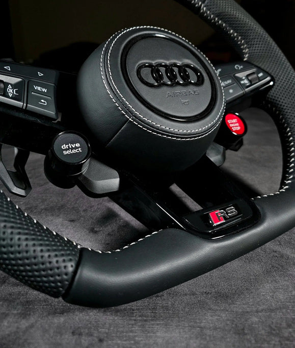 Audi RS steering wheel with R8 Style buttons: black Drive Select button and red Start Engine Stop button, airbag cover in leather with white stitching